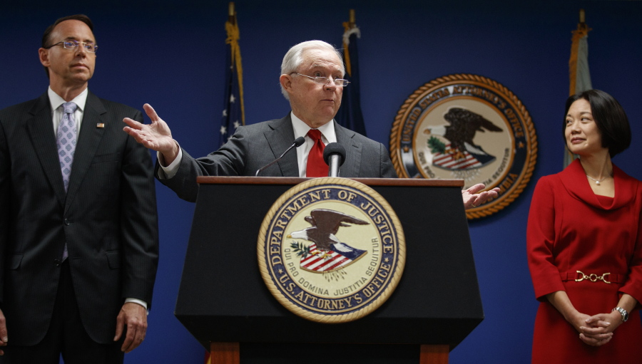 Attorney General Jeff Sessions, joined by Deputy Attorney General Rod Rosenstein, left, and Jessie Liu, U.S. Attorney for the District of Columbia, right, speaks during a news conference at the U.S. Attorney’s Office for the District of Columbia in Washington on Monday to announce on efforts to reduce transnational crime.