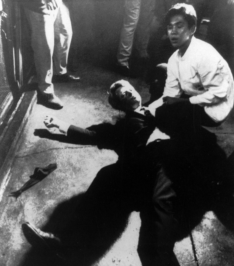 Busboy Juan Romero comes to the aid of Sen. Robert F. Kennedy as he lies on the floor of the Ambassador Hotel in Los Angeles moments after he was shot on June 5, 1968.