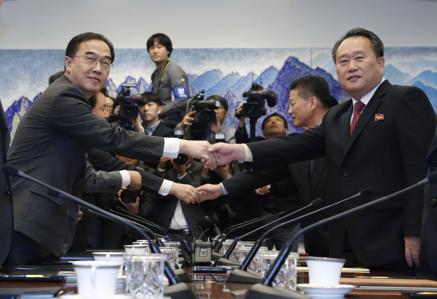 South Korean Unification Minister Cho Myoung-gyon, left, shakes hands with his North Korean counterpart Ri Son Gwon during their meeting at the southern side of Panmunjom in the Demilitarized Zone, South Korea, on Monday. The rival Koreas are holding high-level talks Monday to discuss further engagement amid a global diplomatic push to resolve the nuclear standoff with North Korea.