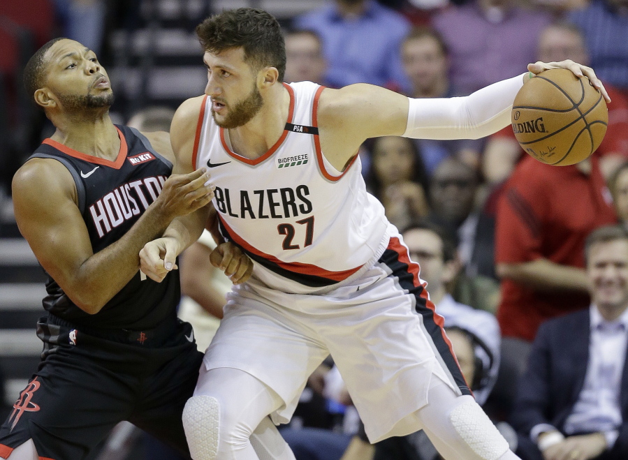 Portland Trail Blazers center Jusuf Nurkic (27) dribbles as Houston Rockets guard Eric Gordon defends during the first half of an NBA basketball game, Tuesday, Oct. 30, 2018, in Houston.