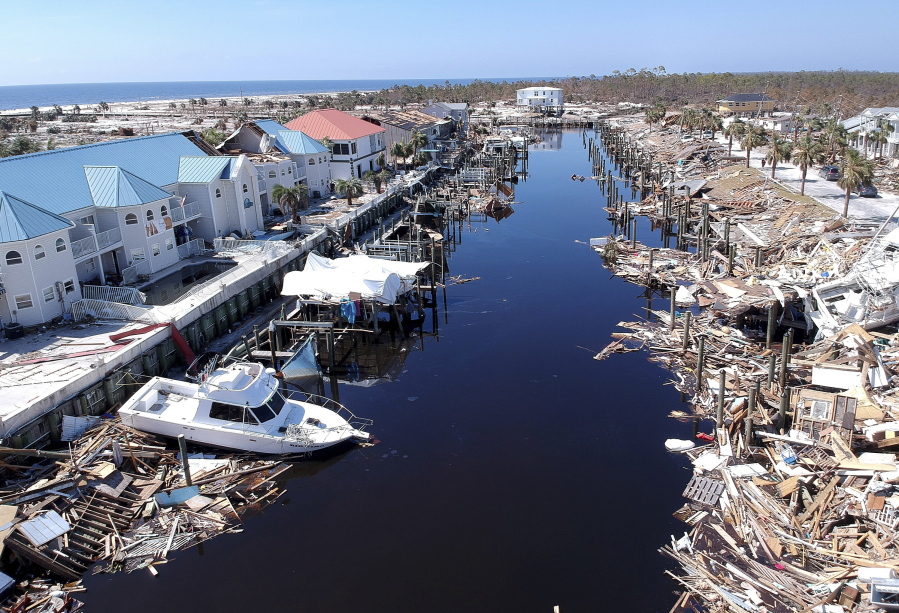 Debris litters a canal in Mexico Beach, Fla. on Monday, Oct. 15, 2018. as first responders continue to search for missing people in this tiny Florida Panhandle community devastated by Hurricane Michael.