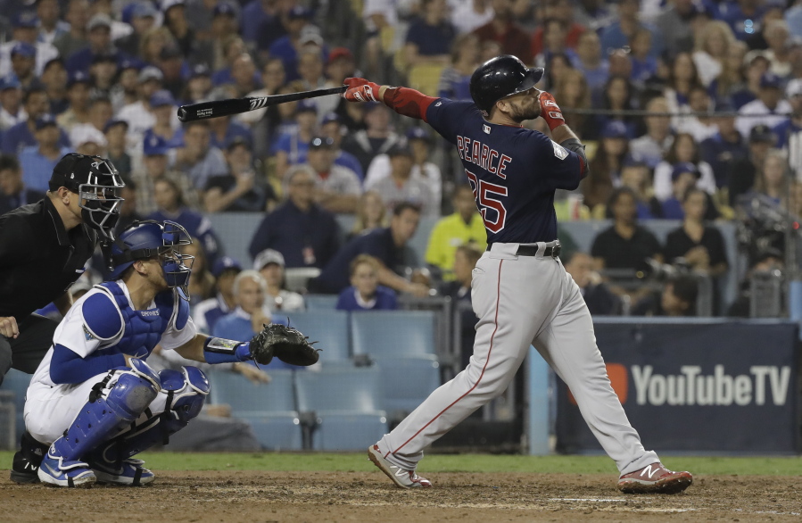 Boston Red Sox's Steve Pearce watches his solo home run to tie the game during the eighth inning in Game 4 of the World Series baseball game against the Los Angeles Dodgers on Saturday, Oct. 27, 2018, in Los Angeles. (AP Photo/David J.
