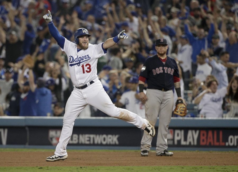 Los Angeles Dodgers’ Max Muncy celebrates after his walk off home run against the Boston Red Sox during the 18th inning in Game 3 of the World Series baseball game on Saturday, Oct. 27, 2018, in Los Angeles. (AP Photo/Jae C.