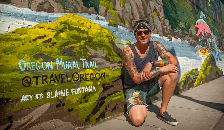 Artist Blaine Fontana in front of The Dalles’ mural at the Mount Hood Railroad.