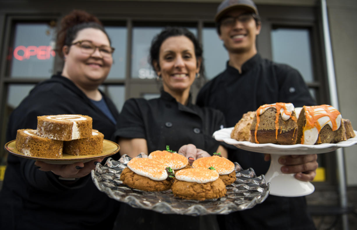 Pastry chef Kyley Grabner, from left, owner and baker Dana Carpenter, and baker Calvin Goon show off a selection of fall treats at Di Tazza in Camas.