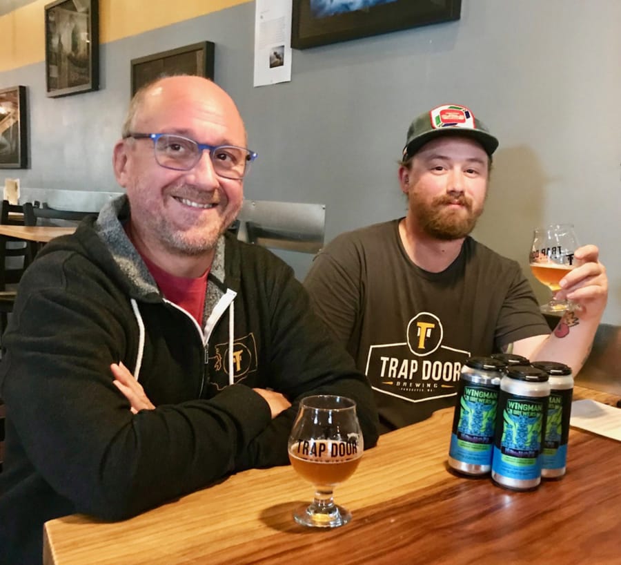 Bryan Shull, left, and Zane Singleton of Trap Door Brewing sample some of their Mighty HighPA.