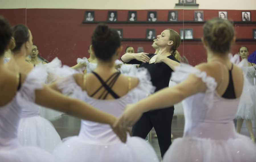 Andrea Thompson, the new creative director at Northwest Classical Ballet, helps dancers fine-tune their moves during rehearsal for “The Nutcracker.” (Natalie Behring for The Columbian)