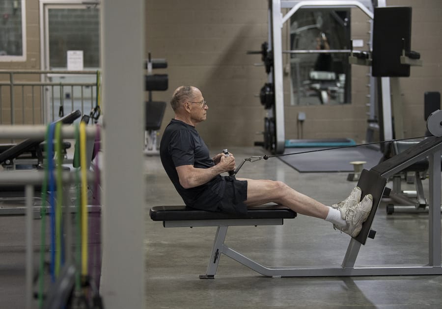 Steve Archer powers through a workout at Cascade Athletic Club in Vancouver. Archer’s exercise routine mostly focuses on weightlifting, although he also likes to walk and will sometimes use the elliptical for cardio.