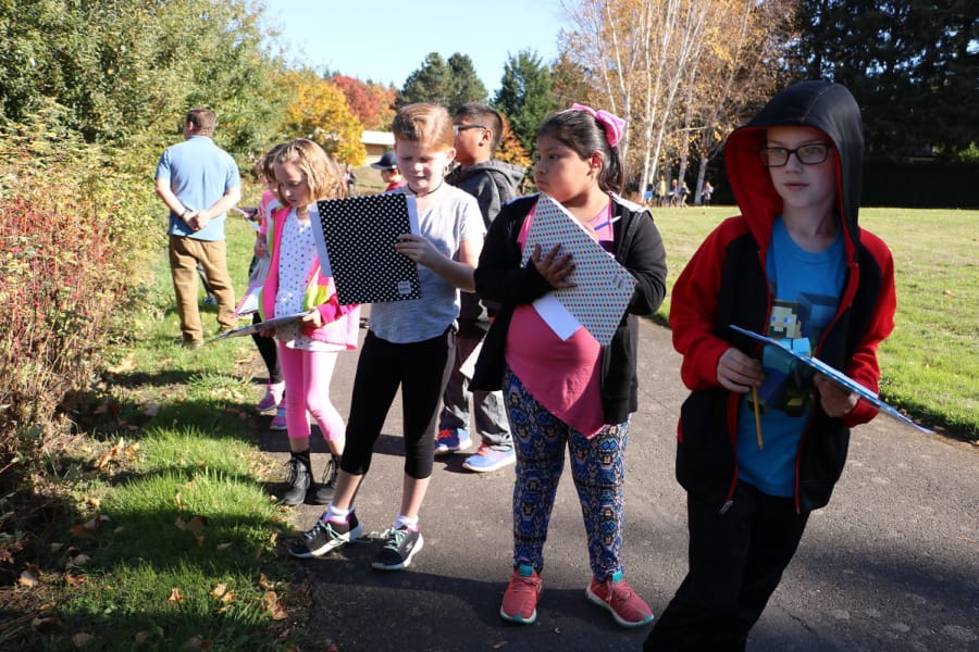 Battle Ground: Talea Jones’ third-graders at Pleasant Valley Primary School taking notes on native plants while coming up with a plan to create a healthy habitat to attract and protect endangered Taylor’s checkerspot butterflies.