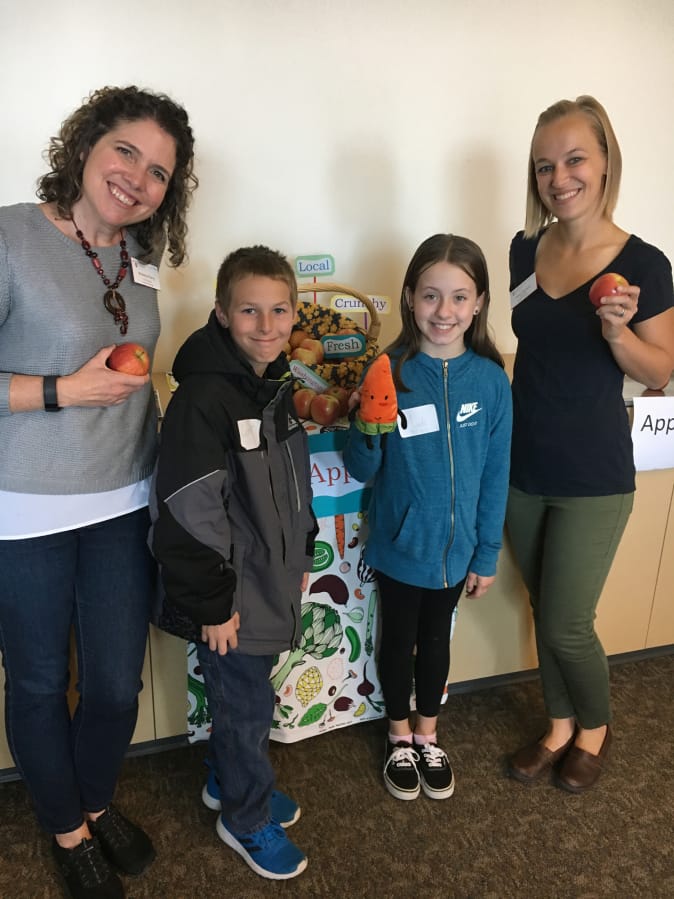 Central Park: Washington State University Extension’s Supplemental Nutrition Assistance Program Education’s Kristine Perry, from left, with Mill Plain Elementary School’s Madi Evin and Connor Stratton and Anna Weyrauch, also from WSU.