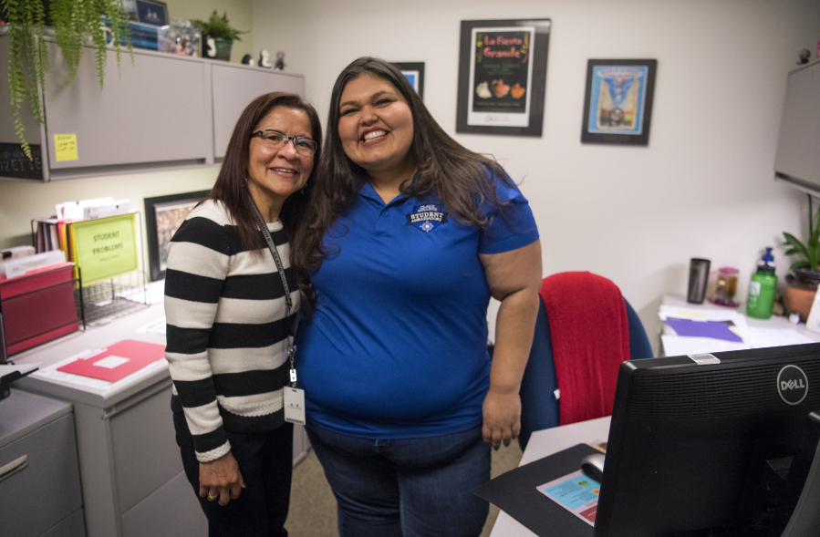 Clark College scholarships specialist Lizette Drennan, left, visits with Esmeralda “Vita” Blanco at Drennan’s office at Gaiser Hall. Drennan has helped Blanco with many scholarship applications over the years.