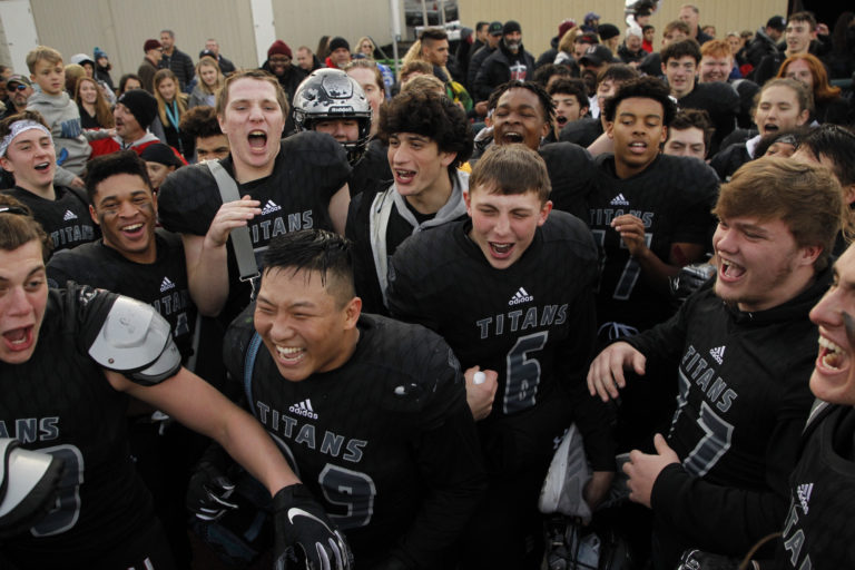 Union players celebrate after defeating  Puyallup.