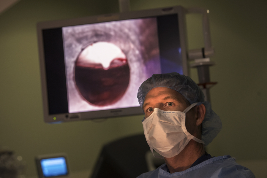 Dr. Scott Rushing, the medical director of PeaceHealth Southwest’s GYN/oncology services, monitors the insertion of an instrument during his 1,000th robotic surgery at PeaceHealth Southwest Medical Center in Vancouver. Rushing is one of three to four active Northwest surgeons in his field to have completed 1,000 robotic surgeries.