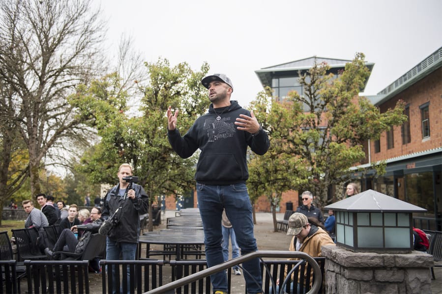 Patriot Prayer’s Joey Gibson speaks to a crowd during a protest on the Washington State University Vancouver campus Oct. 23.