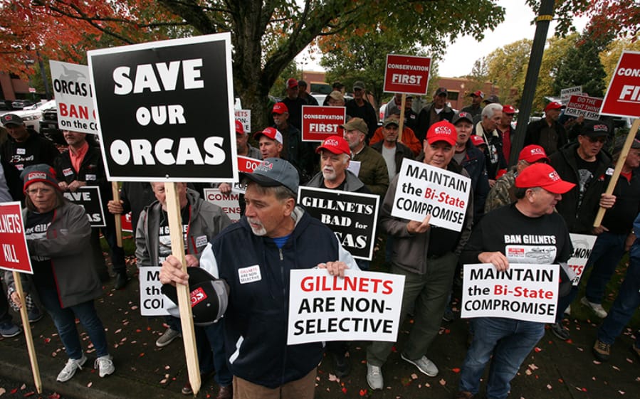 Members of the Coastal Conservation Association protest outside a bi-state fish and wildlife commission meeting on Nov. 1 at the Heathman Lodge in Vancouver. The states are considering dropping a policy that removes commercial gill nets from the Columbia River.