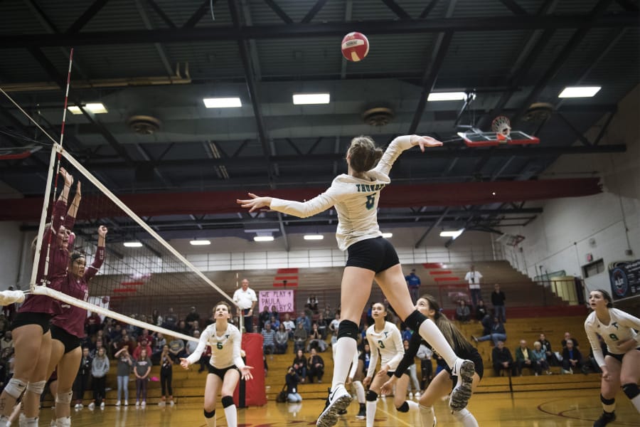 Mountain View’s Grace Garmire, one of seven seniors on the Thunder volleyball team, jumps to spike the ball against Prairie during a recent match.