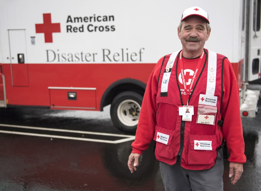 Ron Burby Red Cross volunteer Ron Burby of Vancouver stands for a photo in front of a Red Cross vehicle on Wednesday in December. Burby, who started disaster relief volunteering with the Red Cross late 2017, was sent to Northern California Monday to help with relief efforts in the wake of the deadly Camp Fire on Monday.