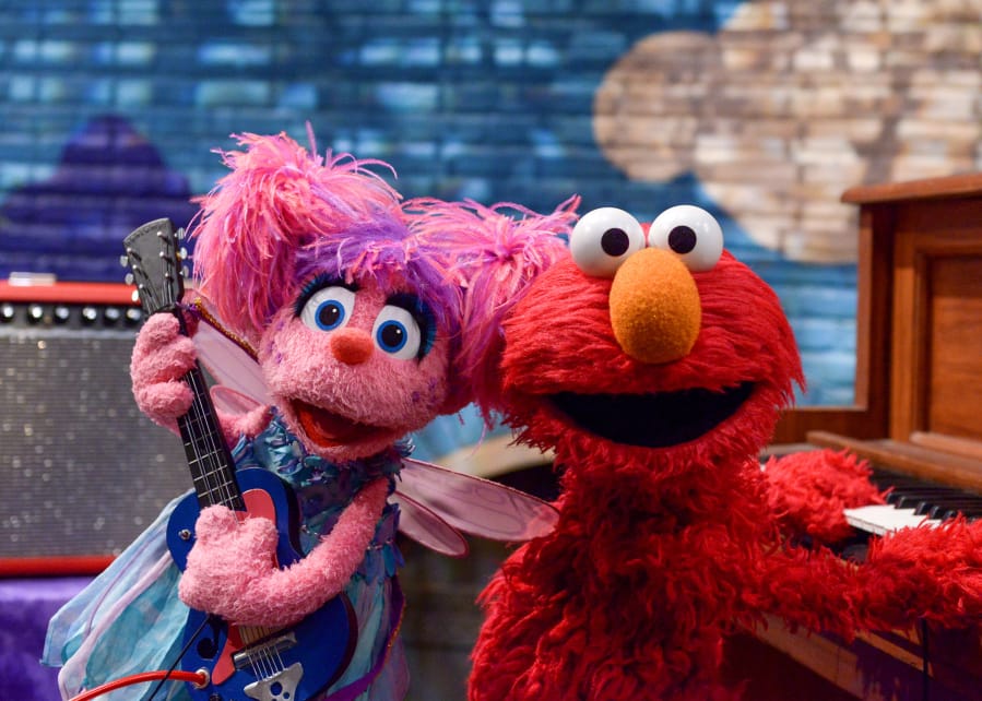 Abby Cadabby, left, and Elmo are ready to rock with the return of Sesame Street Records.