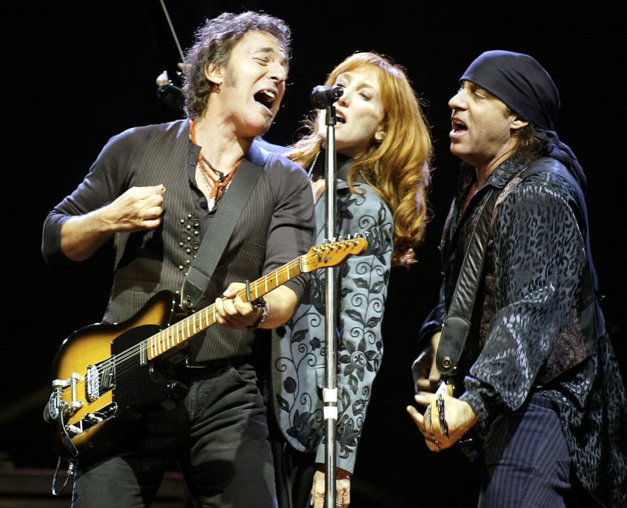Bruce Springsteen, left, performs with his wife, Patti Scialfa, and Steve Van Zandt in Gelsenkirchen, Germany, in May 2003. Van Zandt is spearheading an education project using the history of rock music as a way to teach U.S. history and culture.