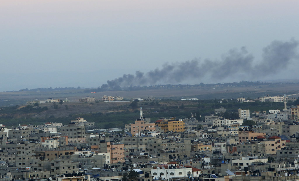 Smoke rises from a mortar attack by Gaza militants on Israel, in Gaza City, Monday, Nov. 12, 2018. Palestinian militants on Monday fired dozens of rockets and mortar shells into southern Israel, critically wounding an Israeli teen, in an intense barrage of projectiles aimed at seeking revenge for a deadly Israeli military incursion late Sunday. The Israeli military responded by dispatching fighter jets to strike throughout the Gaza Strip.