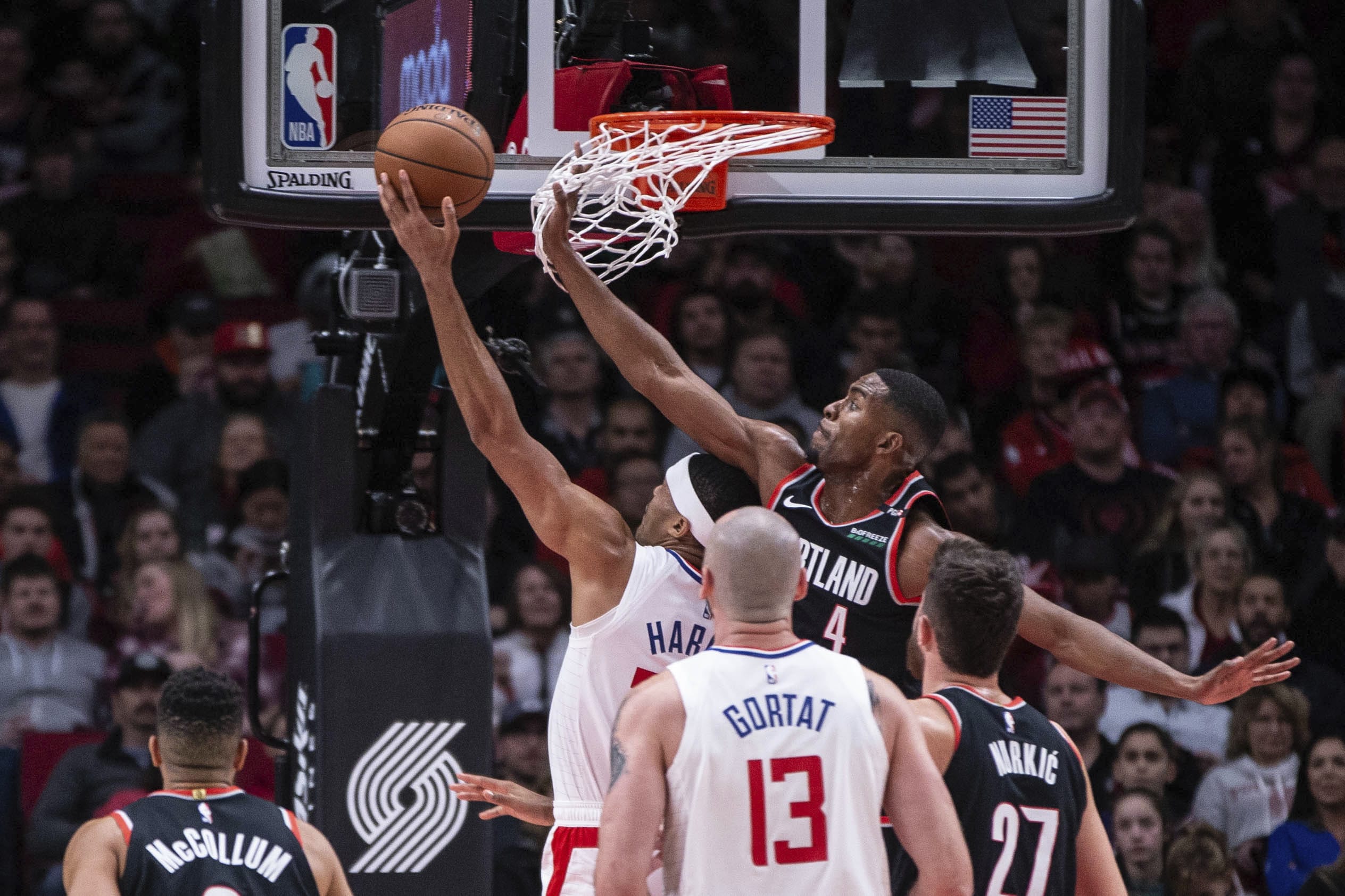 Portland Trail Blazers' Maurice Harkless (4) tries to defend as Los Angeles Clippers's Tobias Harris goes to the basket during the game Sunday, Nov. 25, 2018. Los Angeles won 104-100.