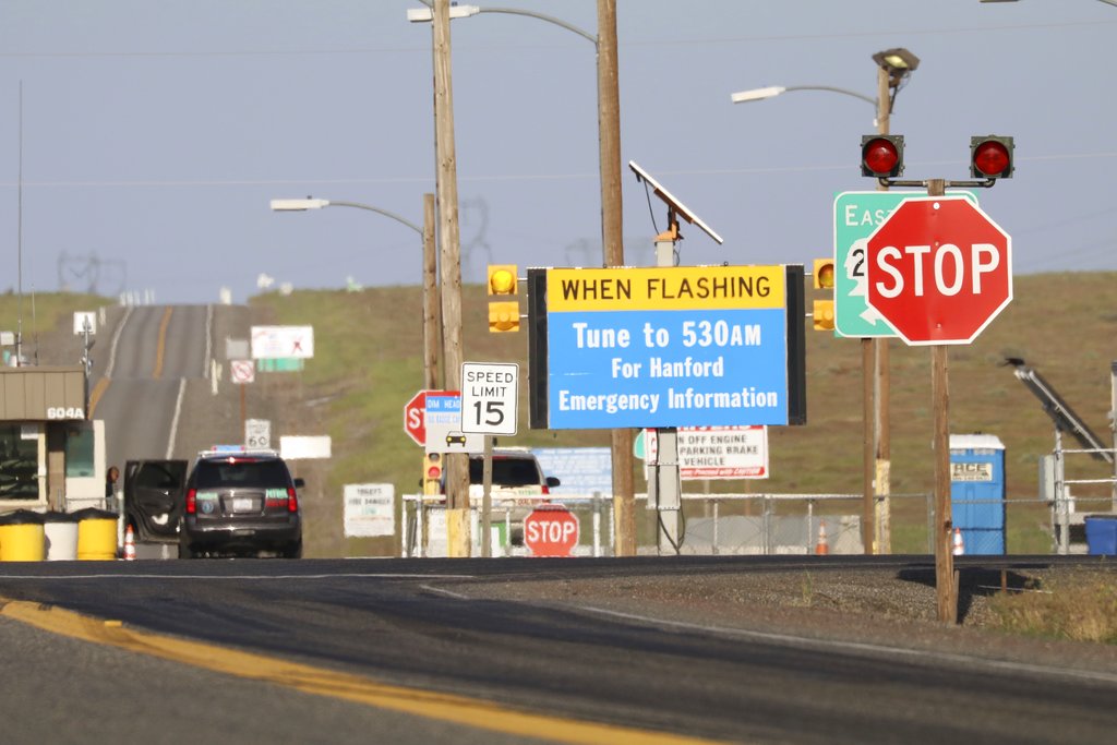FILE--In this May 9, 2017, file photo, an entry point to the Hanford Nuclear Reservation is shown near Richland, Wash. The federal government is threatening to sue Washington state to block recent legislation that helps workers at the former nuclear weapons production site win compensation claims for illnesses.