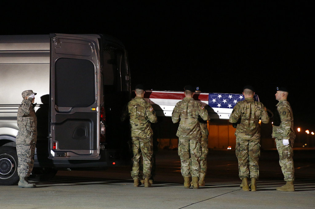 A U.S. Army carry team prepares to place a transfer case containing the remains of Capt. Andrew P. Ross into a vehicle, Friday, Nov. 30, 2018, at Dover Air Force Base, Del. According to the Department of Defense, Ross, 29, of Lexington, Va., was killed Nov. 27, 2018, by a roadside bomb in Andar, Ghazni Province, Afghanistan.