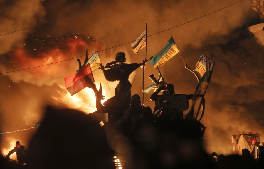 Monuments to Kiev’s founders burn as anti-government protesters clash with riot police in Kiev’s Independence Square, the epicenter of the country’s then unrest, Kiev, Ukraine. Russian border guards opened fire on three Ukrainian vessels late Sunday, Nov. 25, 2018 in the Kerch Strait near the Russia-occupied Crimean peninsula, raising the prospect of a full-scale military confrontation between the two neighbors. The incident comes on the back of a four-and-a-half year long proxy conflict in eastern Ukraine.