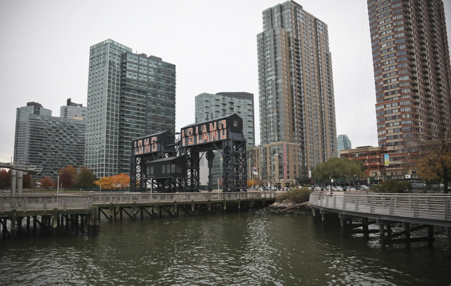 A former dock facility is shown with old transfer bridges, with “Long Island” painted in large letters at Gantry State Park in the Long Island City section of Queens, N.Y. Amazon announced Tuesday it has selected the Queens neighborhood as one of two sites for its additional headquarters. The other is Arlington, Va.