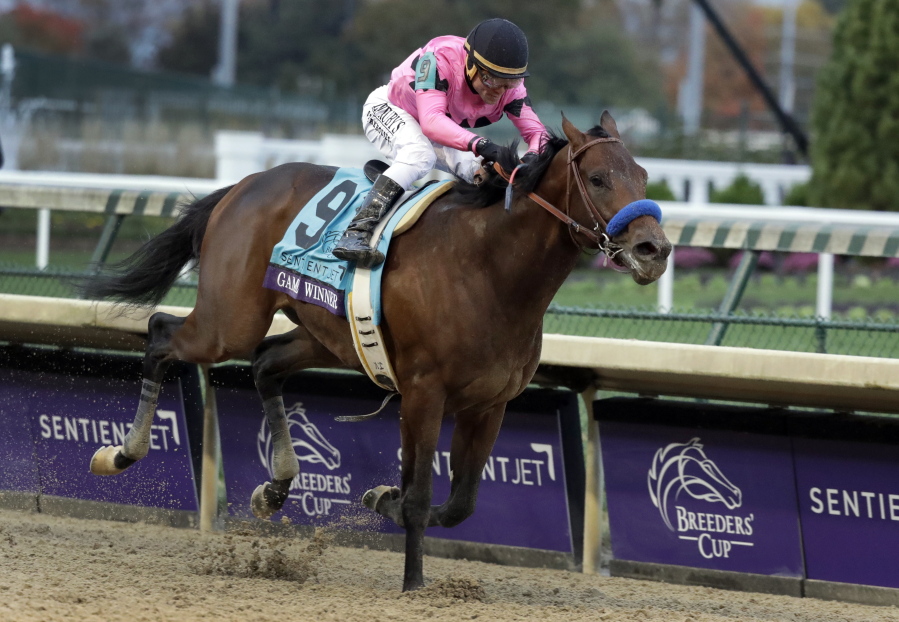 Joel Rosario rides Game Winner to victory in the Breeders’ Cup Juvenile horse race at Churchill Downs, Friday, Nov. 2, 2018, in Louisville, Ky.