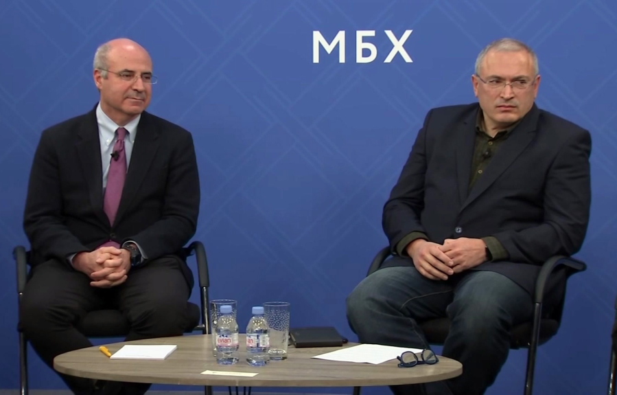 In this image made from video, Kremlin critic Mikhail Khodorkovsky, right, and financier William Browder attend a joint press conference in London, Tuesday, Nov. 20, 2018. Kremlin foes including financier Bill Browder, Mikhail Khodorkovsky and Alexei Navalny have warned that naming a top Russian police official to the job would undermine Interpol. Russian Interior Ministry spokesman Irina Volk lashed out at critics, accusing them of running a “campaign to discredit” the Russian candidate Alexander Prokopchuk.