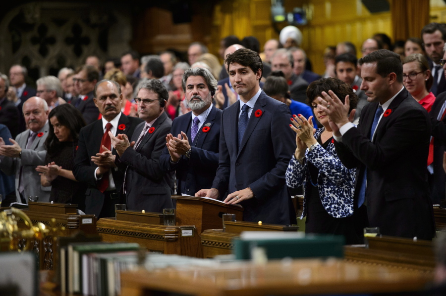 Canadian Prime Minister Justin Trudeau stands to deliver a formal apology on behalf of his nation for turning away a ship full of Jewish refugees trying to flee Nazi Germany in 1939 on Wednesday in the House of Commons in Ottawa.