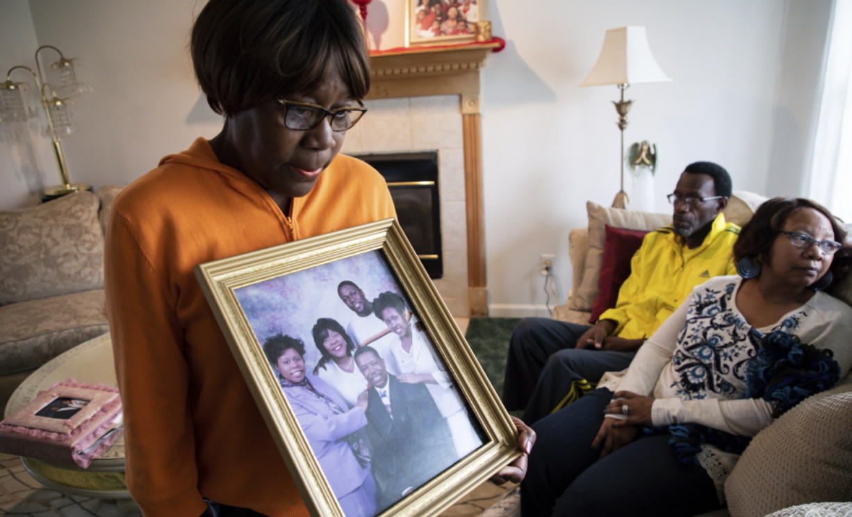 Glenda O’Neal, mother of of Dr. Tamara O’Neal, shows a photo of her family at their home in LaPorte, Ind., Tuesday, Nov. 20, 2018. Dr. Tamara was one of the three people fatally shot Monday at Mercy Hospital, a Chicago hospital.