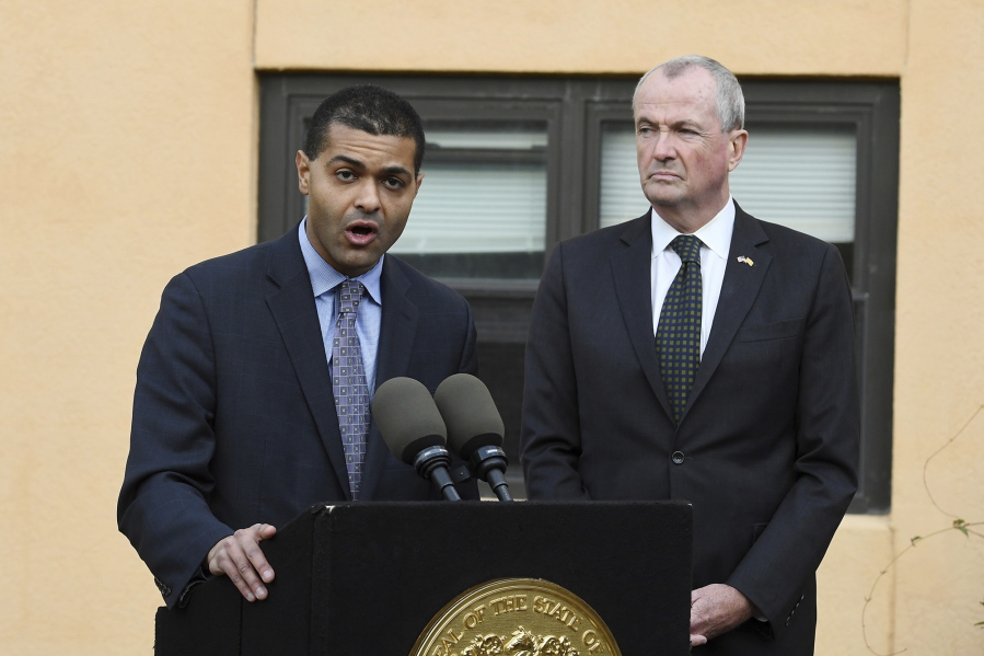 New Jersey Department of Health Commissioner Dr. Shereef Elnahal, left, speaks about the adenovirus outbreak as New Jersey Gov. Phil Murphy looks on during a press conference at the The Wanaque Center for Nursing and Rehabilitation on Wednesday in Wanaque, N.J. There have been 18 cases overall at the Wanaque Center for Nursing and Rehabilitation in Haskell, about 30 miles (50 kilometers) northwest of New York, officials said. The 227-bed, for-profit facility has a pediatric unit but also cares for elderly residents.