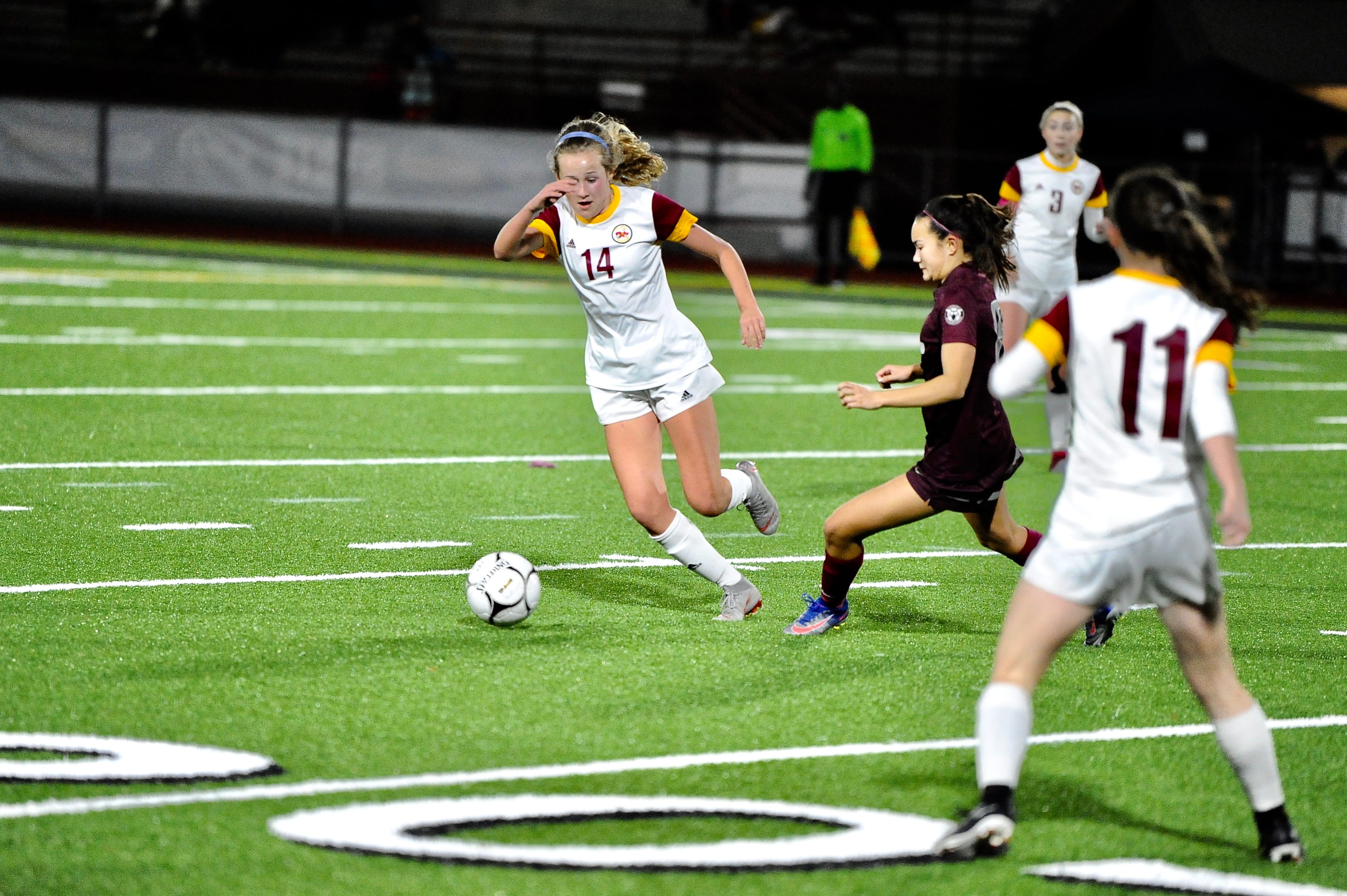 Prairie midfielder Maya Davis dribbles past a defender in the second half of a 3-1 loss to Holy Names in the 3A state semifinals at Puyallup's Sparks Stadium.