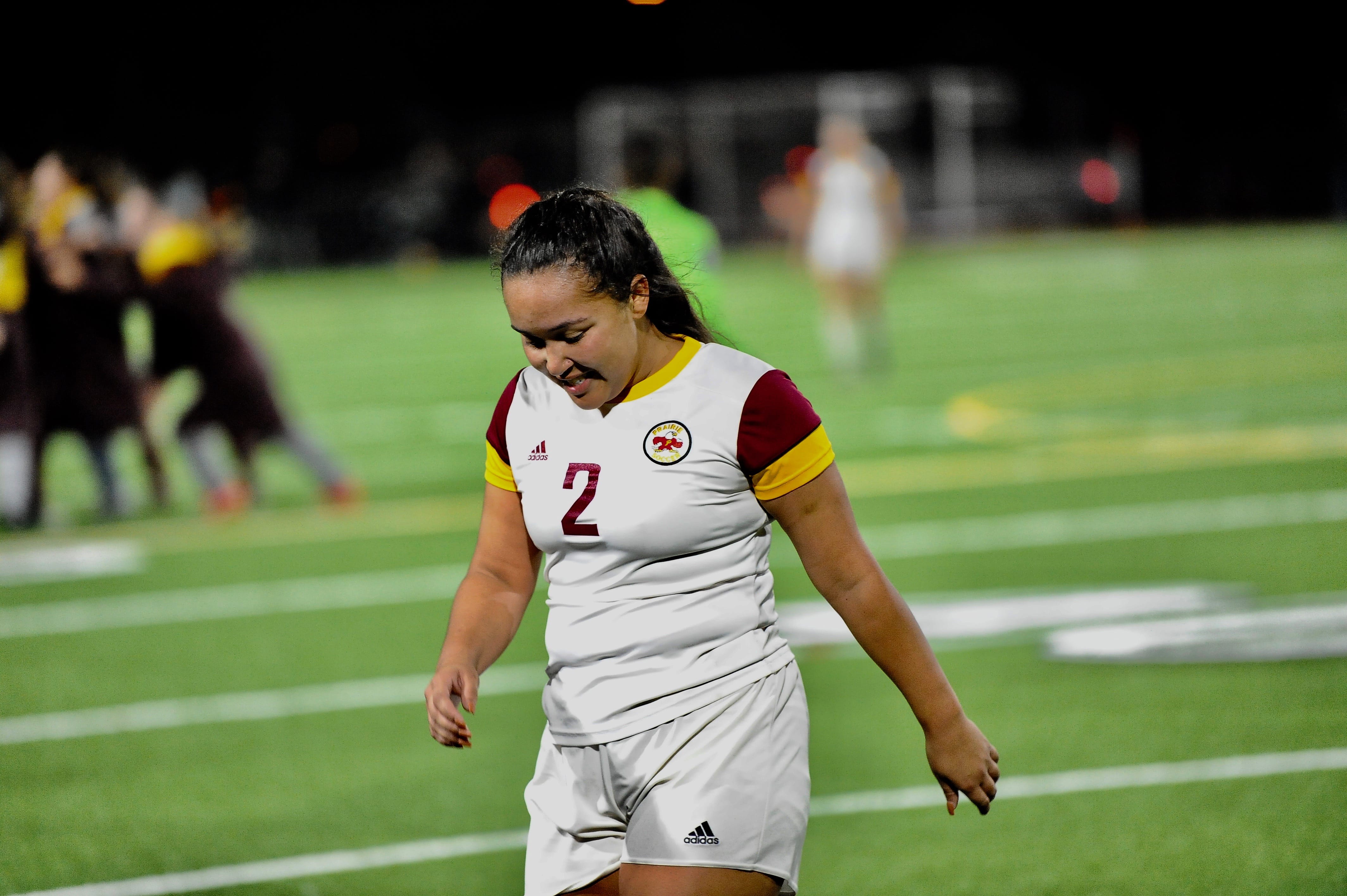 Prairie senior midfielder Malaika Quigley walks off the field at Sparks Stadium in Puyallup moments after the final whistle in a 3-1 loss to Holy Names in the 3A state semifinals.