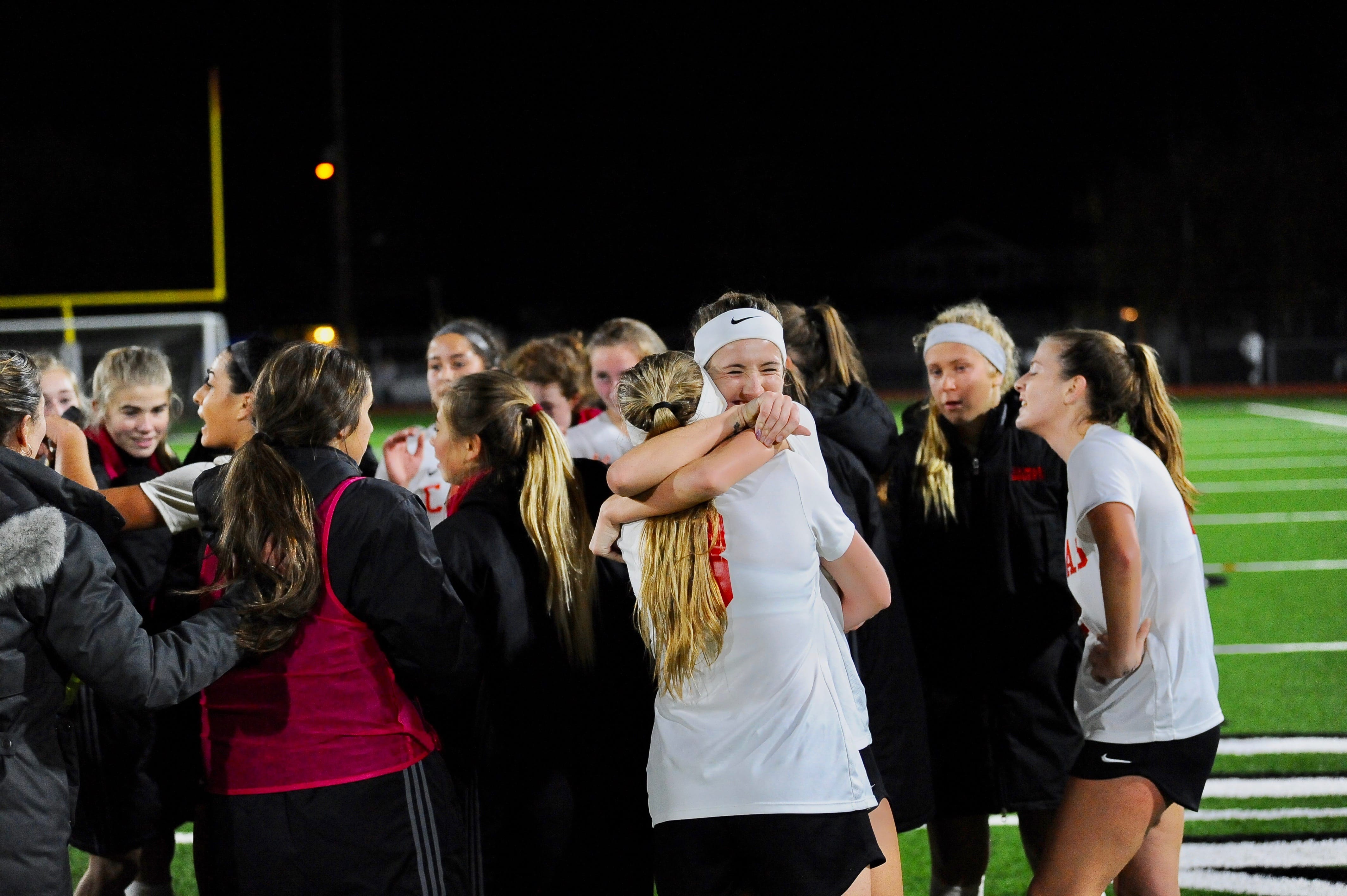 Camas seniors Jenna Efraimson and Jazzy Paulson (8) embrace in the moments after completing a come-from-behind win, 2-1 over Central Valley, in the 4A state semifinals at Sparks Stadium in Puyallup.