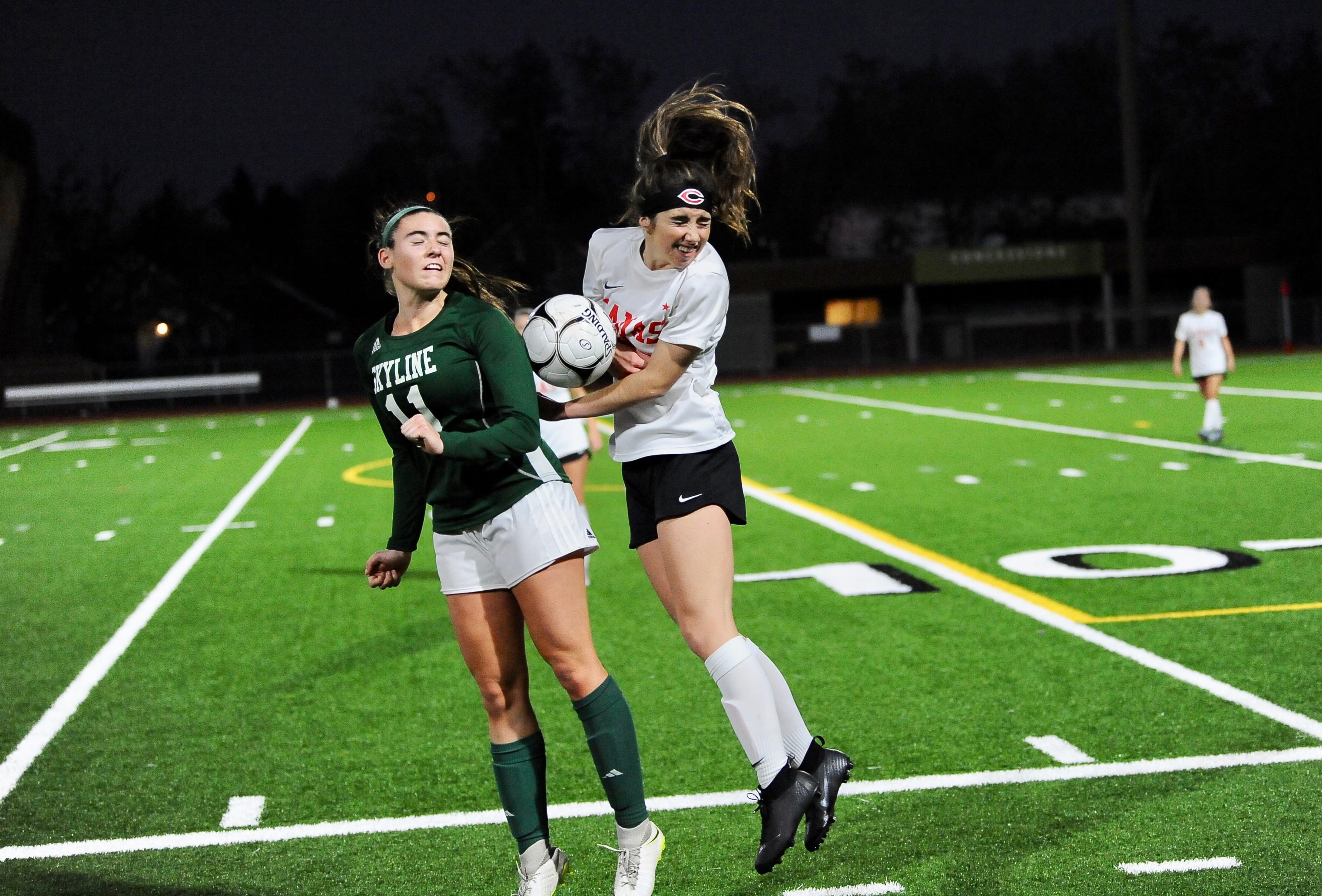 Camas sophomore defender Josephine Rein (right) fights for the ball with Skyline's Katelyn Reilly (left) in the Papermakers' 2-1 loss in the 4A state championship game at Sparks Stadium.