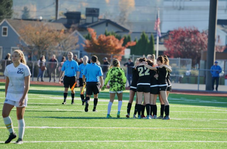 Prairie players embrace in the moments after the final whistle, marking the end of their season after a 3-0 loss at Sparks Stadium in Puyallup on Saturday, Nov. 17, 2018.