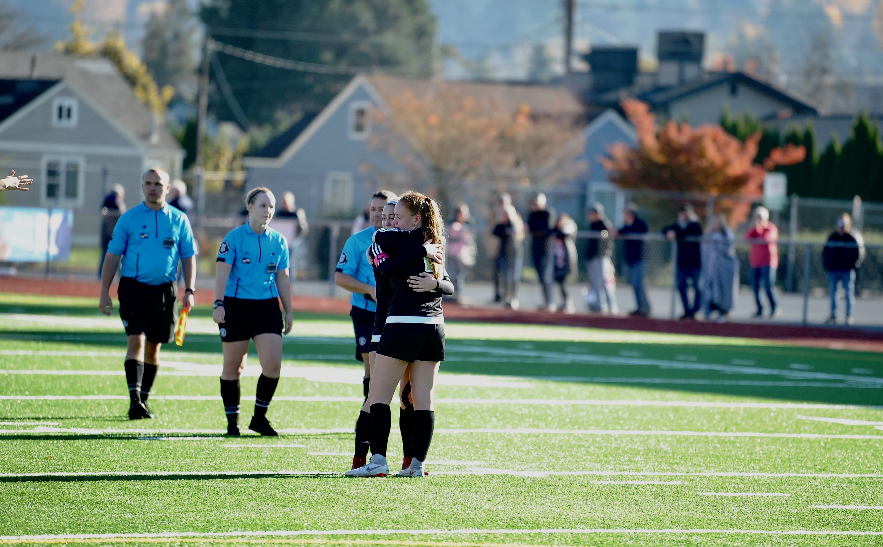 Prairie players embrace in the moments after the final whistle, marking the end of their season after a 3-0 loss at Sparks Stadium in Puyallup on Saturday, Nov. 17, 2018.