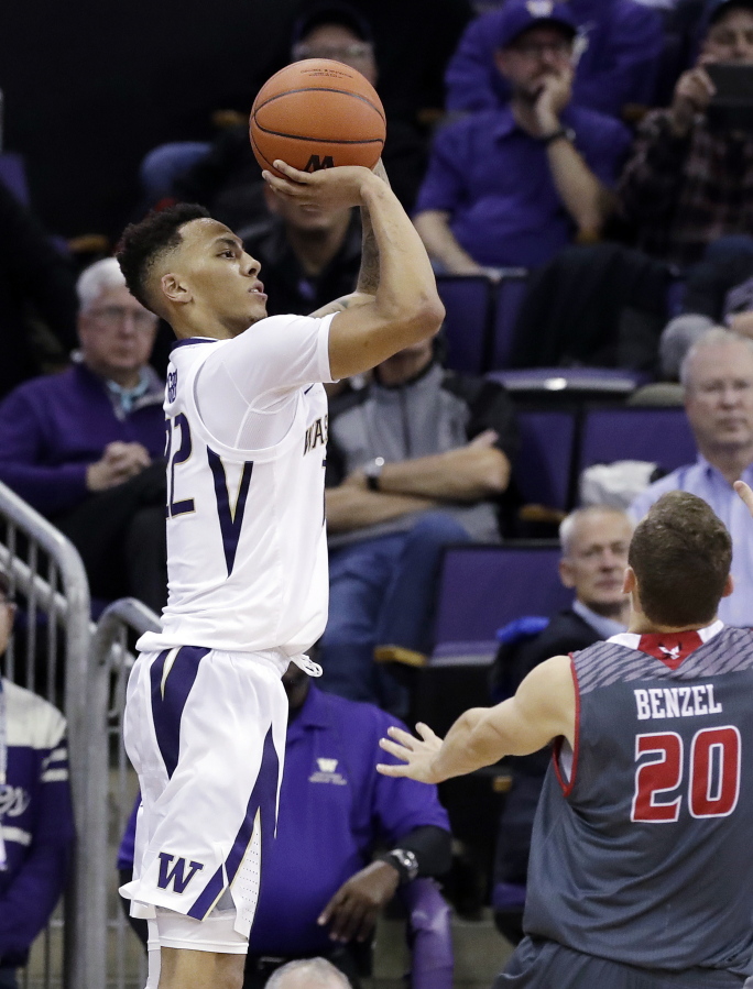 Washington’s Dominic Green shoots over Eastern Washington’s Cody Benzel (20) in the second half of an NCAA college basketball game Tuesday, Nov. 27, 2018, in Seattle. Green lead all scorers with 25 points and Washington won 83-59.