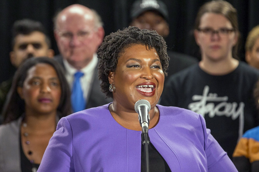 Georgia gubernatorial candidate Stacey Abrams makes remarks during a press conference at the Abrams Headquarters in Atlanta on Friday. Democrat Stacey Abrams says she will file a federal lawsuit to challenge the “gross mismanagement” of Georgia elections. Abrams made the comments in a Friday speech, shortly after she said she can’t win the race, effectively ending her challenge to Republican Brian Kemp.