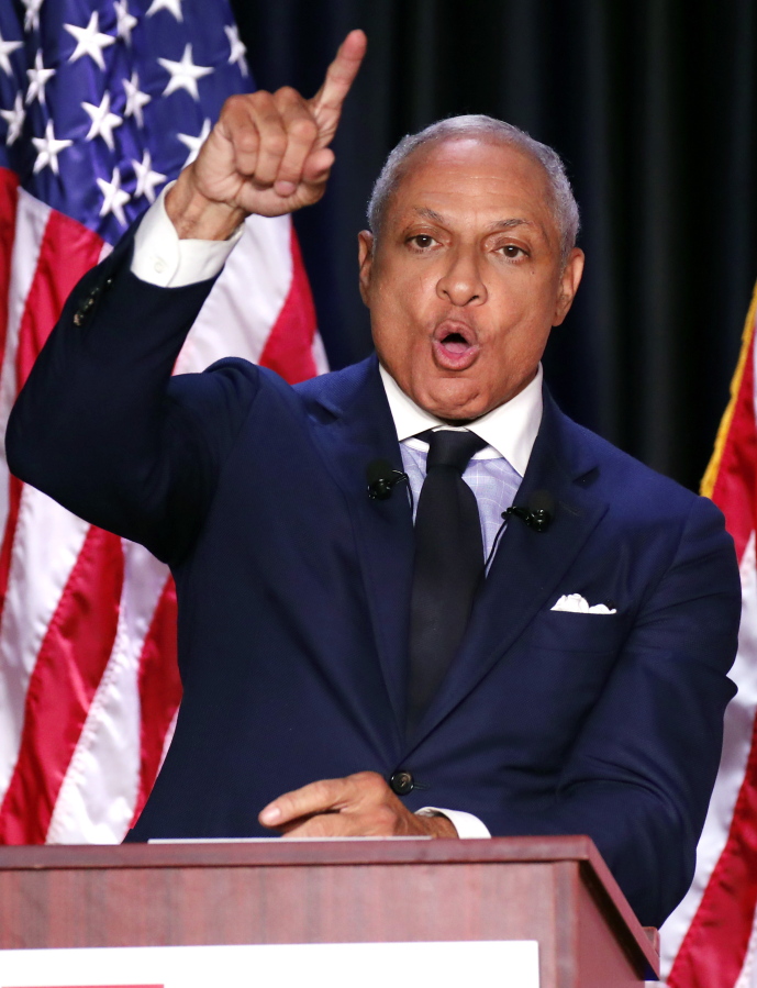 Democrat Mike Espy responds to a statement from his opponent, appointed U.S. Sen. Cindy Hyde-Smith, R-Miss., during a televised Mississippi U.S. Senate debate in Jackson, Miss., on Tuesday. (AP Photo/Rogelio V.
