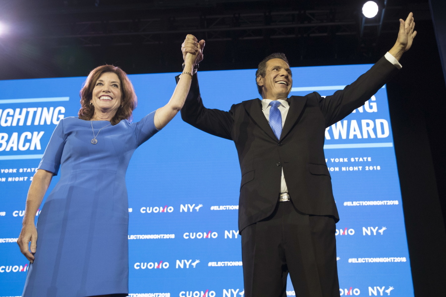 FILE - In this Tuesday, Nov. 6, 2018, file photo, New York Gov. Andrew Cuomo, right, stands with Lieutenant Governor Kathy Hochul during an an election night watch party hosted by the New York State Democratic Committee in New York. Democrats who gained new or expanded powers in state elections are gearing up for a left-leaning push on gun control, universal health care and legal marijuana. Meanwhile, some Republican legislatures that have cut taxes and limited union powers are adjusting to a new reality of needing to work with a Democratic governor. The midterm elections Tuesday, Nov. 6, increased Democratic relevance in state capitols that have been dominated by Republicans during the past decade.