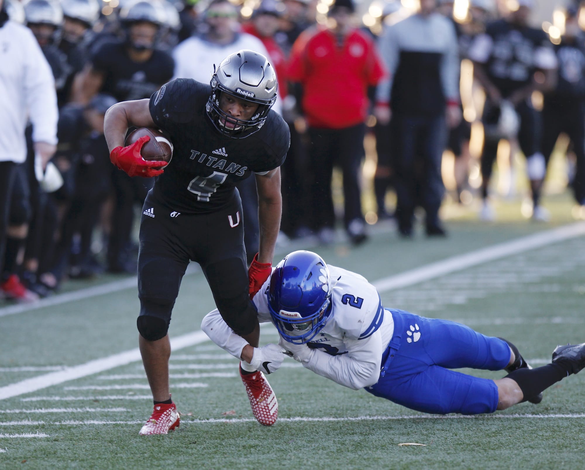 Union running back Isaiah Jones, left, sheds a tackle by Bothell defensive back Darius Kubalanza in the 4A state football quarterfinals.