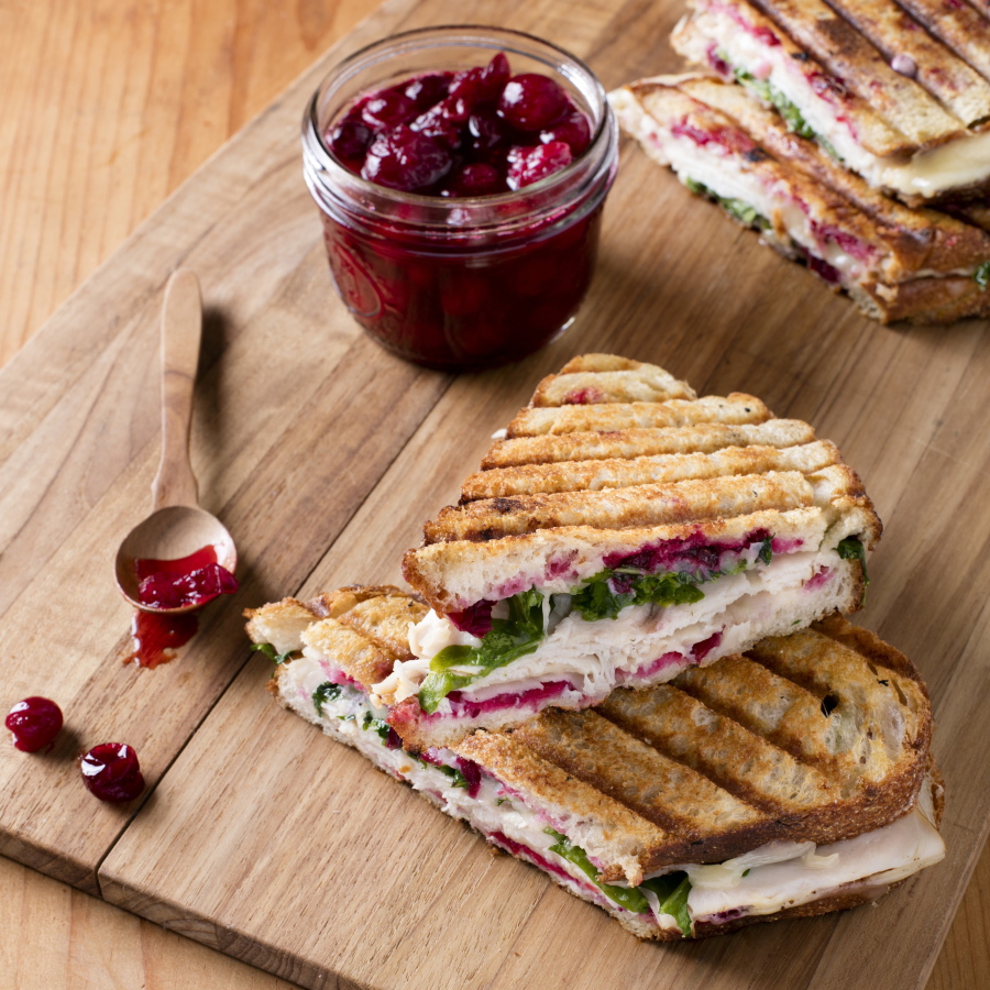 This undated photo provided by America’s Test Kitchen in October 2018 shows smoked turkey panini with simple cranberry sauce in Brookline, Mass.