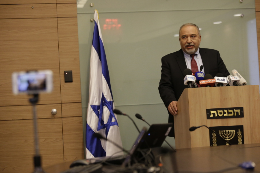 Israeli Defense Minister Avigdor Lieberman delivers a statement at the Knesset, Israel’s Parliament on Wednesday. Lieberman announced his resignation Wednesday over the Gaza cease-fire, making early elections likely.