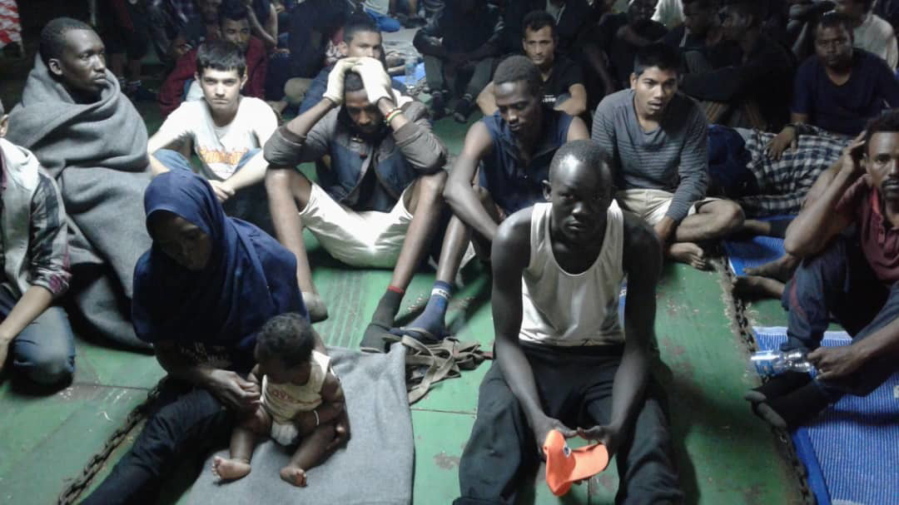 NIn this photo provided Nov. 14, 2018, migrants on board the container ship Nivin are refusing to disembark in Misrata, Libya. A total of 91 migrants, including a baby, were rescued by the ship’s crew last weekend after leaving Libya in a raft.
