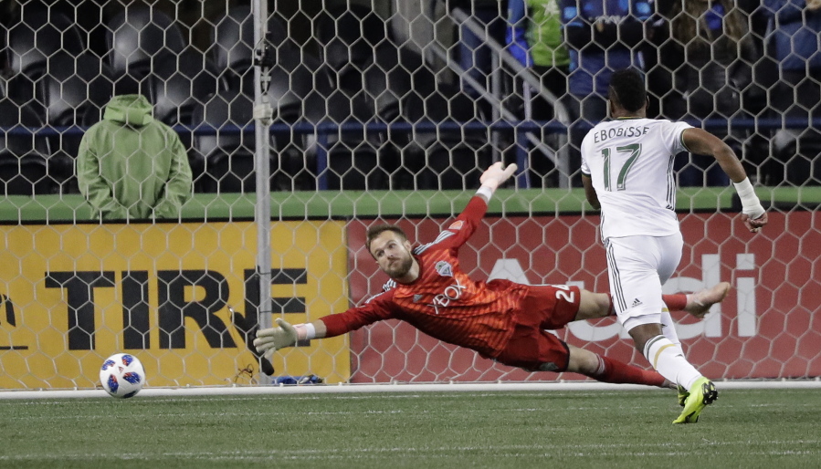 Seattle Sounders goalkeeper Stefan Frei, left can’t get to the ball on a goal by Portland Timbers midfielder Sebastian Blanco, not seen, as Timbers’ Jeremy Ebobisse (17) watches during the second half of a second-leg MLS playoff soccer match Thursday, Nov. 8, 2018, in Seattle. (AP Photo/Ted S.