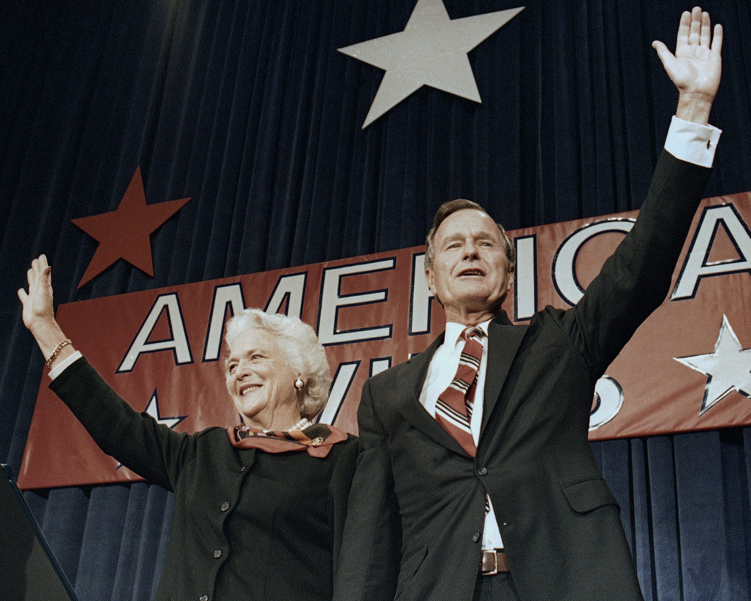 FILE - In this Nov. 8, 1988 file photo, President-elect George H.W. Bush and his wife Barbara wave to supporters in Houston, Texas after winning the presidential election. Bush has died at age 94. Family spokesman Jim McGrath says Bush died shortly after 10 p.m. Friday, Nov. 30, 2018, about eight months after the death of his wife, Barbara Bush.